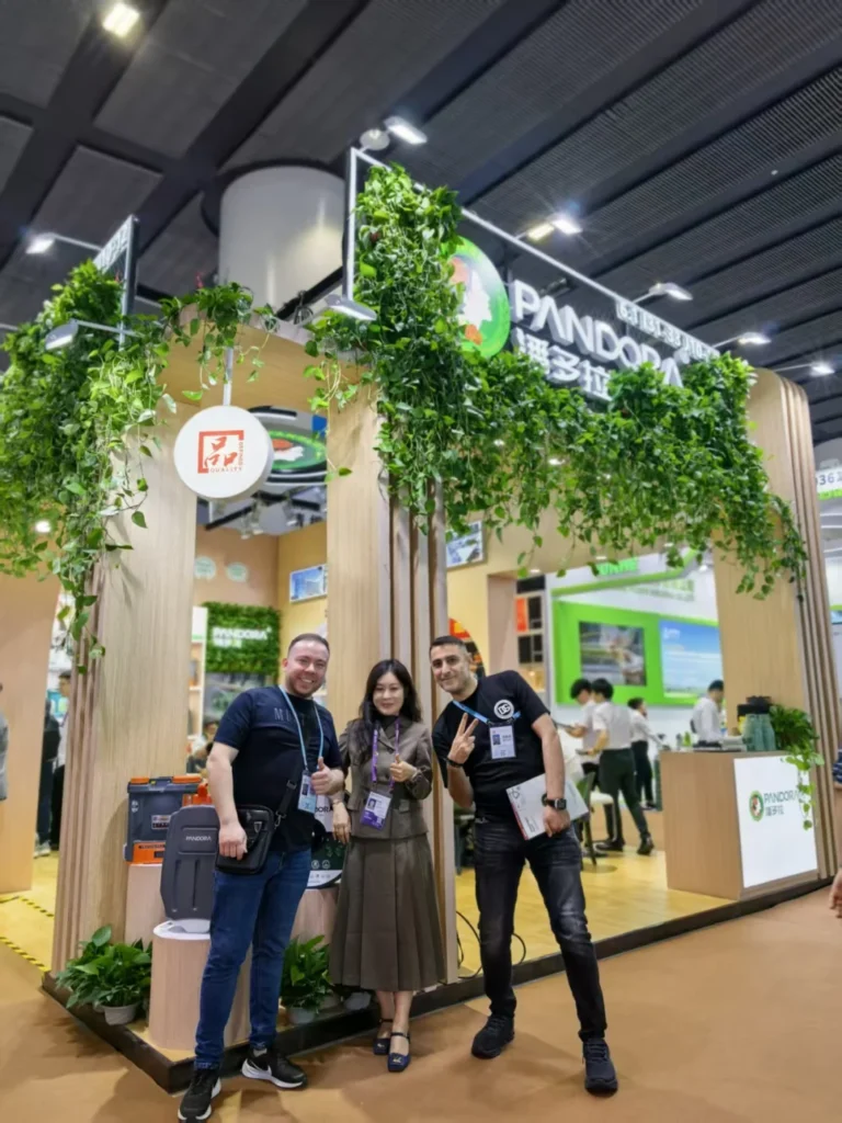PANDORA team members and a partner posing together at the exhibition